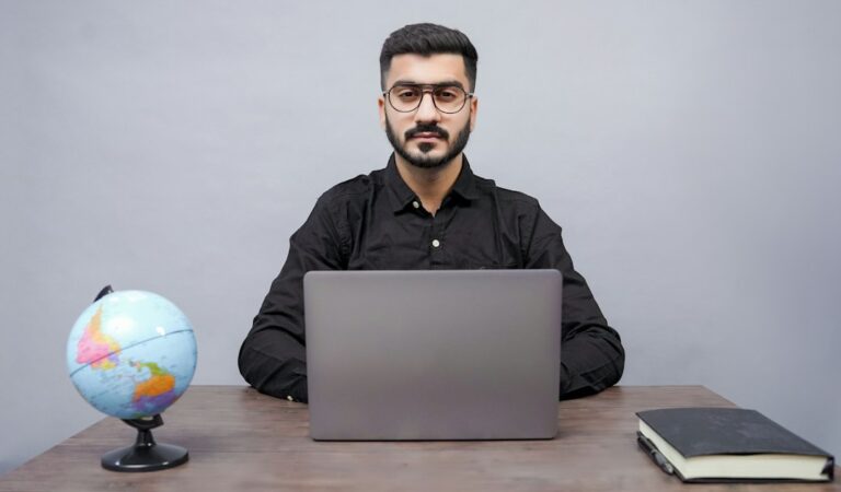 Teacher using a laptop for digital learning and AI-assisted lesson preparation