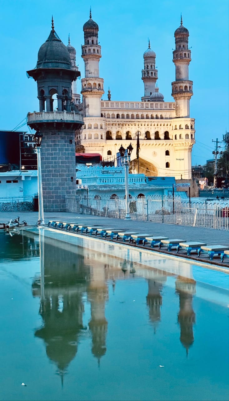 Charminar in Hyderabad reflected in water, a historic monument associated with the beginning of Hijri year 1000