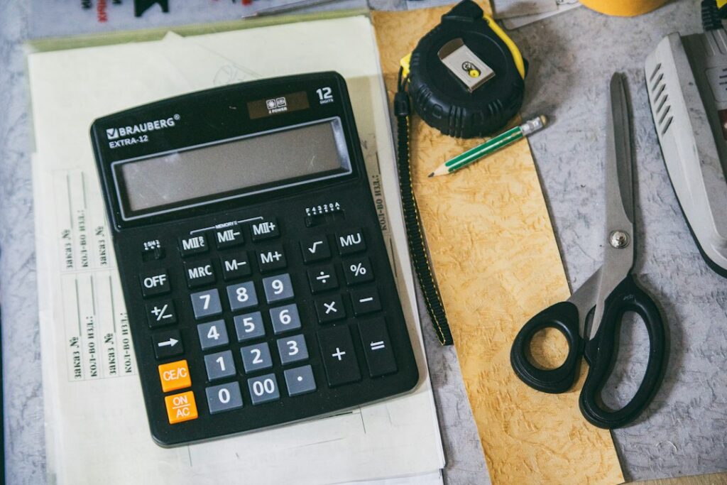 Calculator and office paperwork representing the 2026 dearness allowance increase