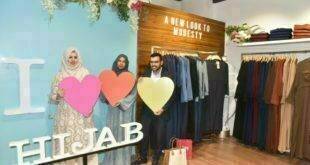 * Women take a look at the modern yet modest fashion apparel introduced by IDH London store during the inauguration of its first store at City Centre Mall at Banjara Hills in Hyderabad on Tuesday.