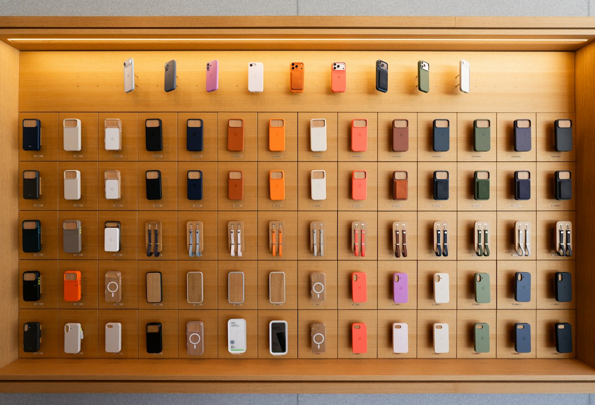 Smartphones and electronic devices displayed on a retail shelf, illustrating India's changing smartphone market