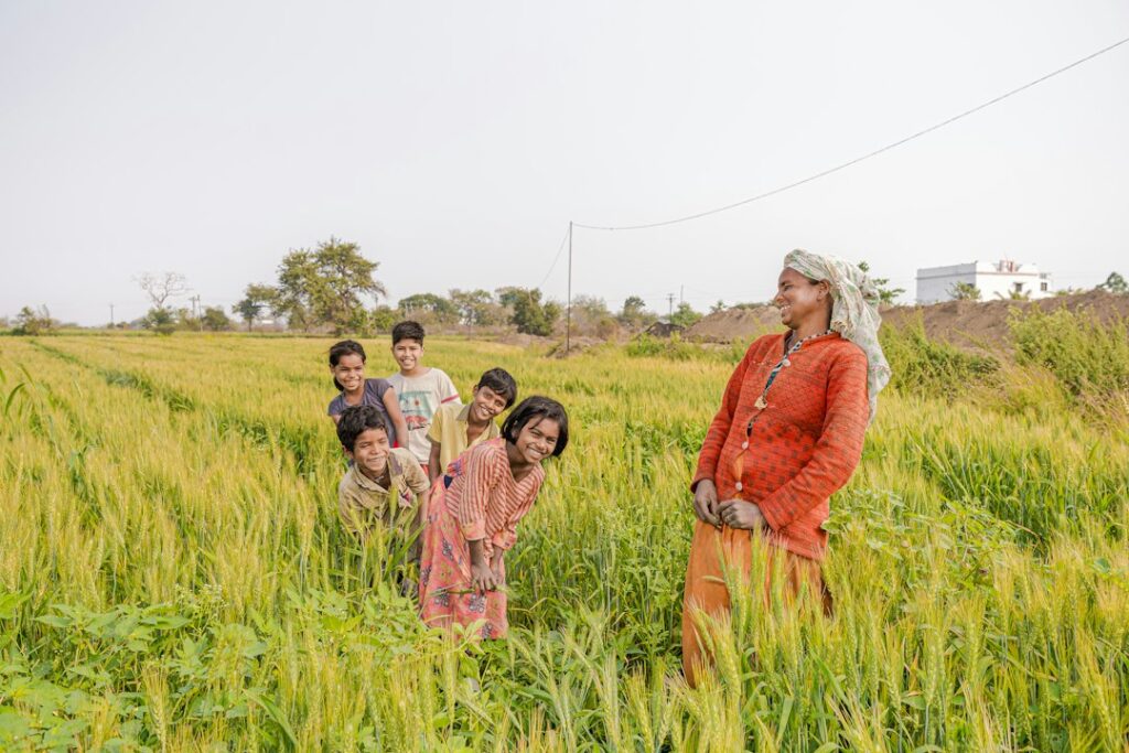 Farmer in a rural Indian agricultural field, representing PM-KISAN beneficiaries