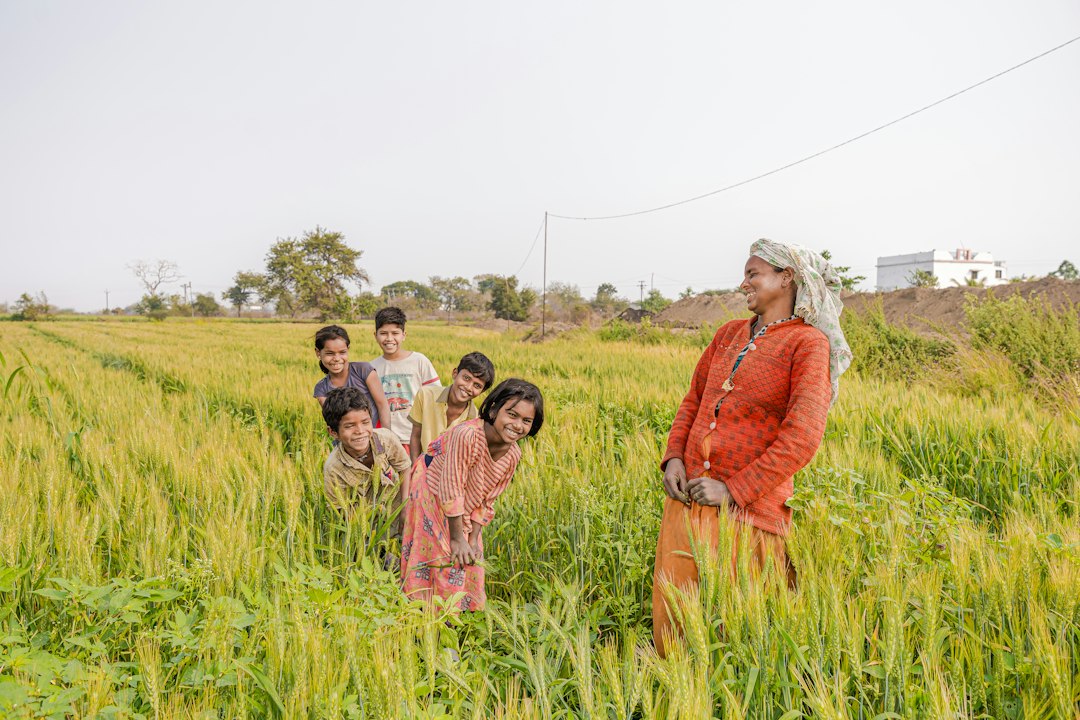 Farmer in a rural Indian agricultural field, representing PM-KISAN beneficiaries