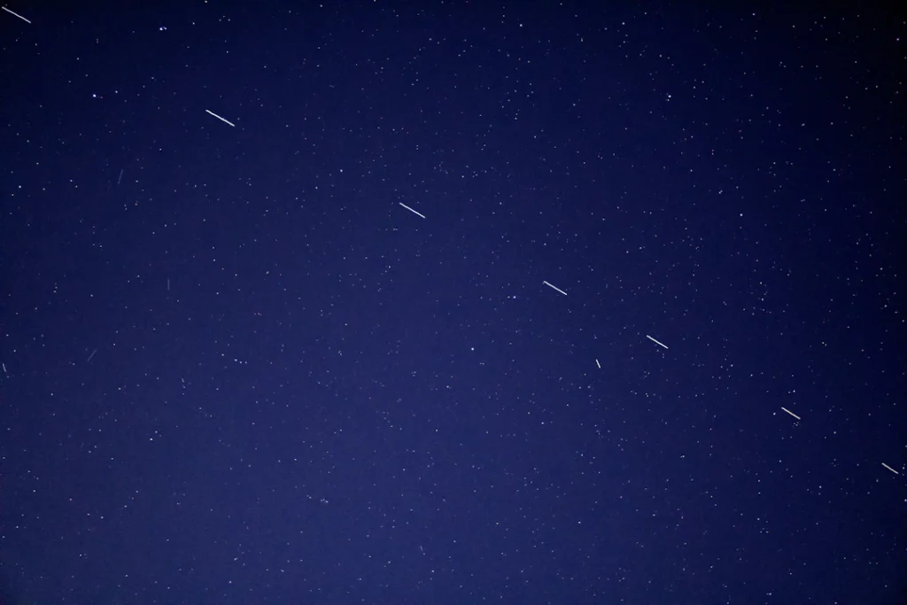 A night sky with bright points of light, used to explain small objects in space
