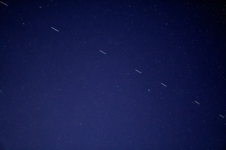 A night sky with bright points of light, used to explain small objects in space