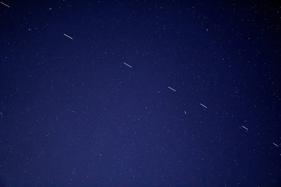 A night sky with bright points of light, used to explain small objects in space