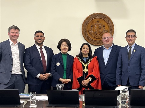 Mayor Sandy Reddy, wearing red, pictured with fellow Strathfield councillors in an official council photograph