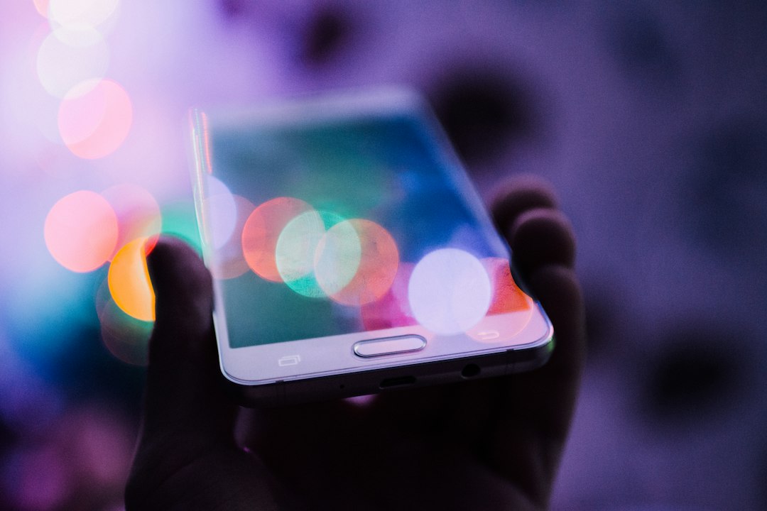 Close-up of a person holding a smartphone, illustrating the ColorOS 17 software update