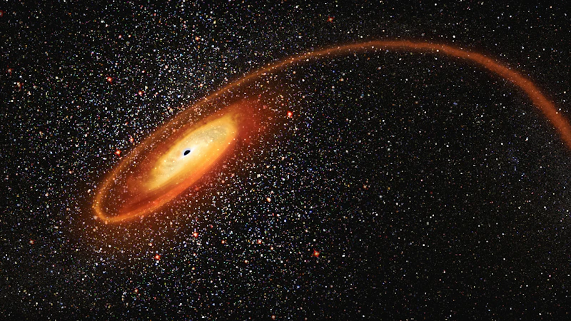 Scientific illustration of a black hole surrounded by a glowing disk of hot gas in deep space